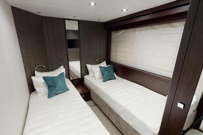  Yacht Photos Pics Luxurious twin cabin interior on 2018 Sunseeker 95 Yacht, featuring elegant design and cozy bedding.