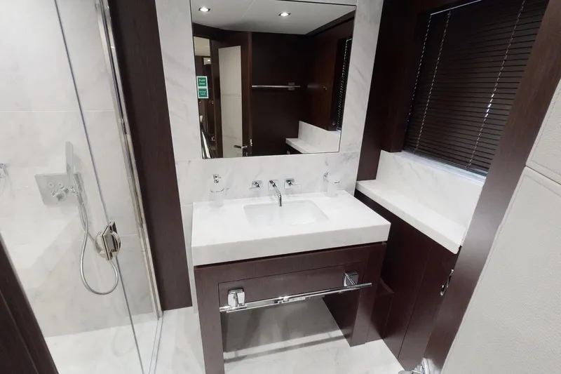  Yacht Photos Pics Luxurious bathroom in 2018 Sunseeker 95 Yacht with modern fixtures and elegant design.