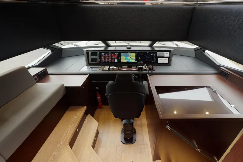  Yacht Photos Pics Luxurious helm of 2018 Sunseeker 95 Yacht with advanced navigation controls and seating.