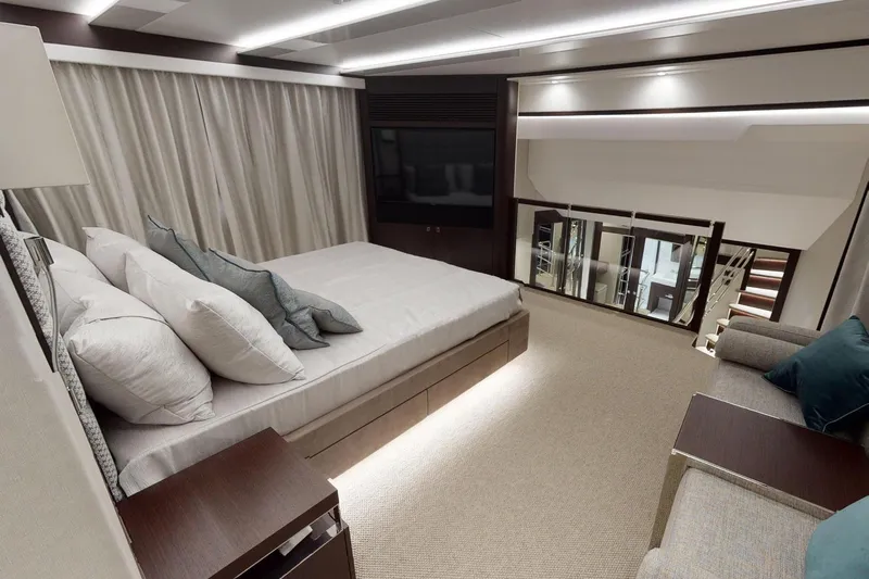  Yacht Photos Pics Luxurious bedroom interior of 2018 Sunseeker 95 Yacht with modern design and elegant furnishings.