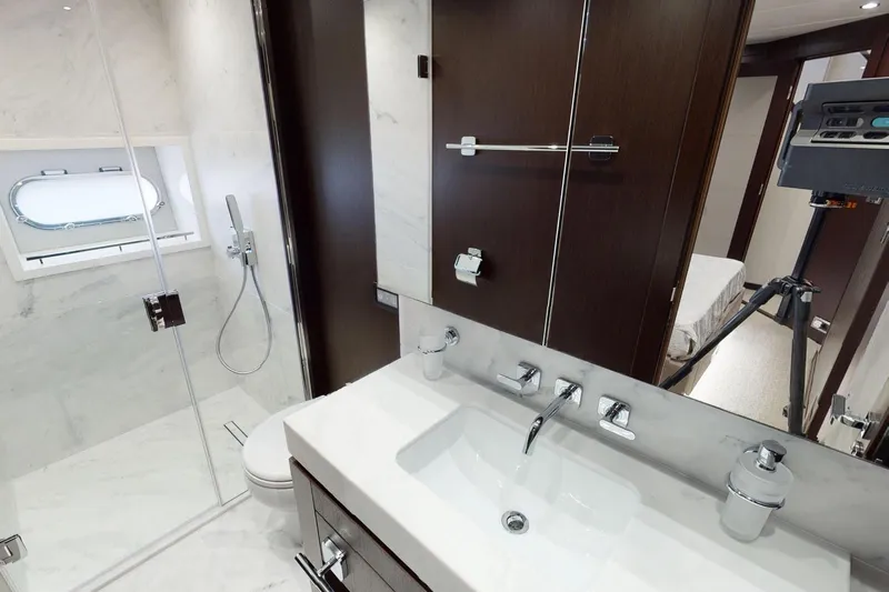  Yacht Photos Pics Luxurious bathroom interior on 2018 Sunseeker 95 Yacht, featuring modern fixtures and elegant design.