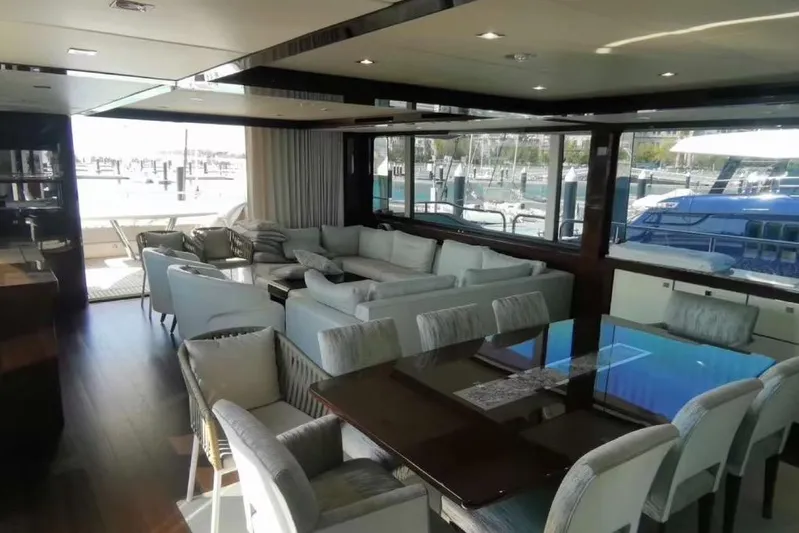  Yacht Photos Pics Luxurious interior of 2018 Sunseeker 95 Yacht with elegant seating and dining area.