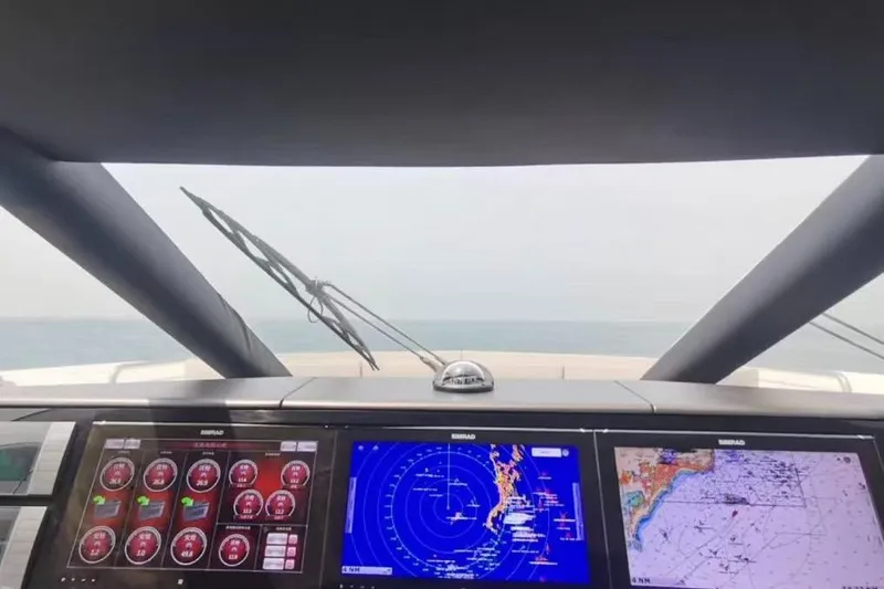  Yacht Photos Pics Cockpit view of 2018 Sunseeker 95 Yacht with navigation screens and ocean horizon.