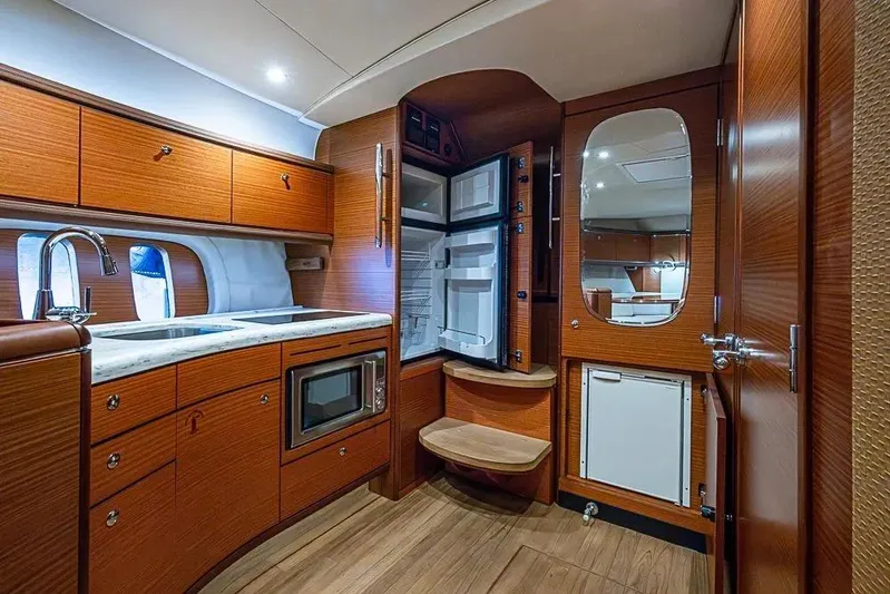 Gazelle Yacht Photos Pics Luxurious 2014 Zeelander Z44 yacht interior with modern kitchen and wooden cabinetry.