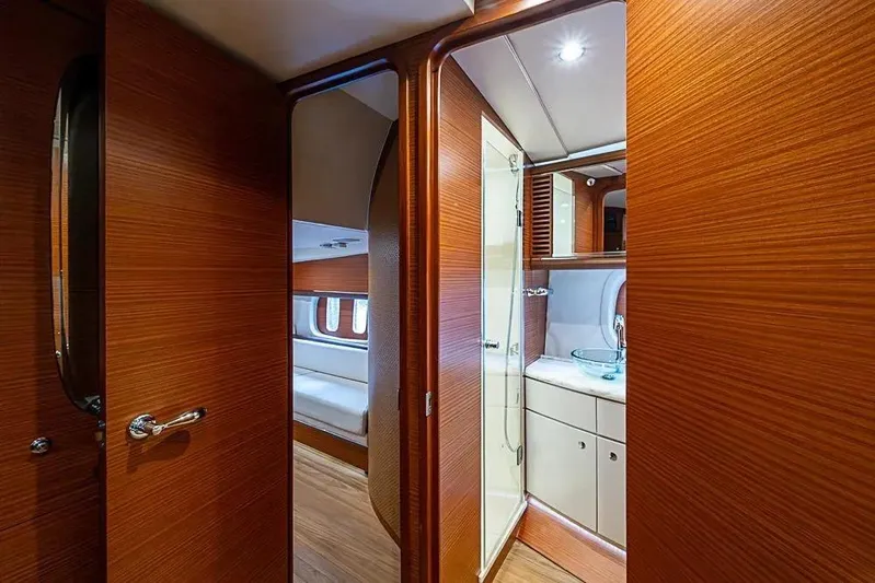 Gazelle Yacht Photos Pics Luxurious interior of 2014 Zeelander Z44 yacht featuring wood paneling and modern bathroom.