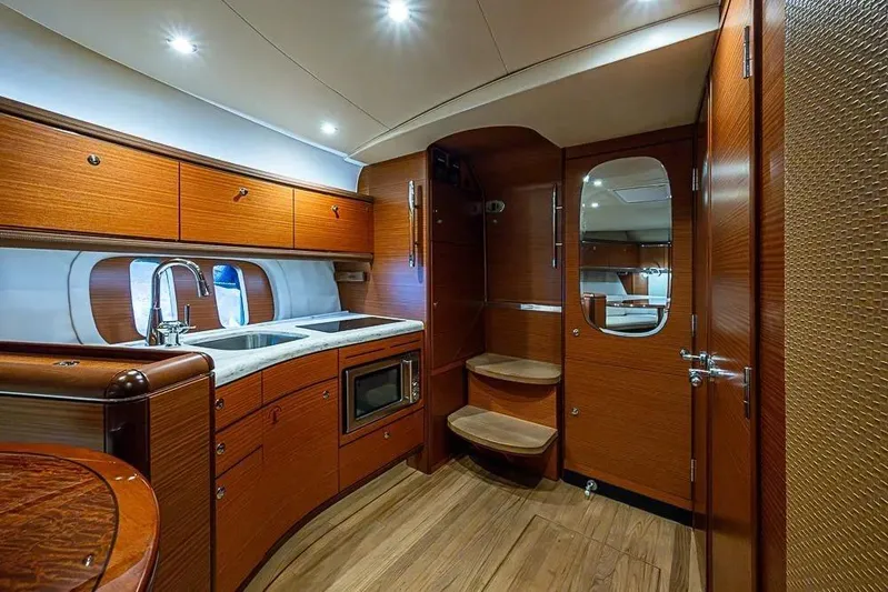 Gazelle Yacht Photos Pics Luxurious 2014 Zeelander Z44 yacht interior with wooden cabinetry and modern kitchen amenities.