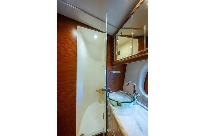 Gazelle Yacht Photos Pics Luxurious bathroom in 2014 Zeelander Z44 yacht with glass sink and wooden accents.