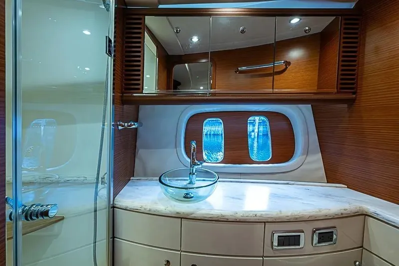 Gazelle Yacht Photos Pics Luxurious bathroom interior of 2014 Zeelander Z44 yacht with glass sink and wooden accents.
