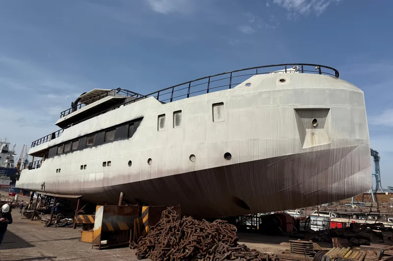 Soyaslan Custom Made Yacht Photos Pics Large Soyaslan Custom yacht in shipyard, 2027 model, under maintenance with clear blue sky.