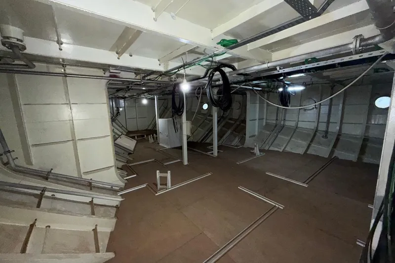Soyaslan Custom Made Yacht Photos Pics Interior of a 2027 Soyaslan Custom ship under construction, showing wiring and structural elements.