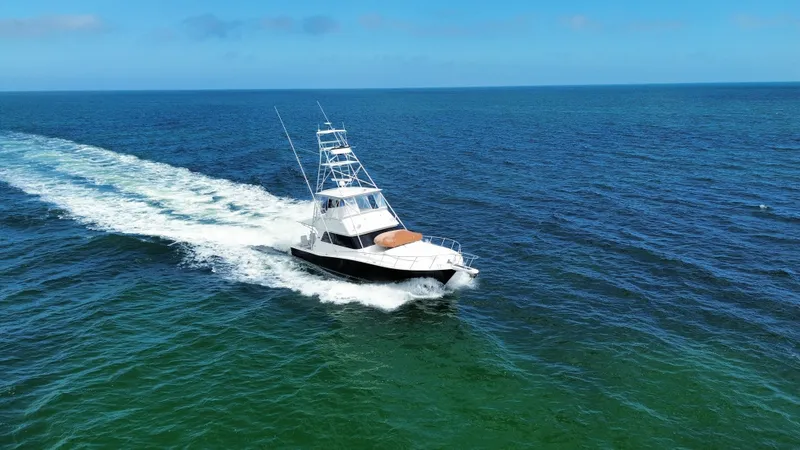 Calypso Yacht Photos Pics Viking 47 Convertible yacht cruising on open sea, 1996 model.