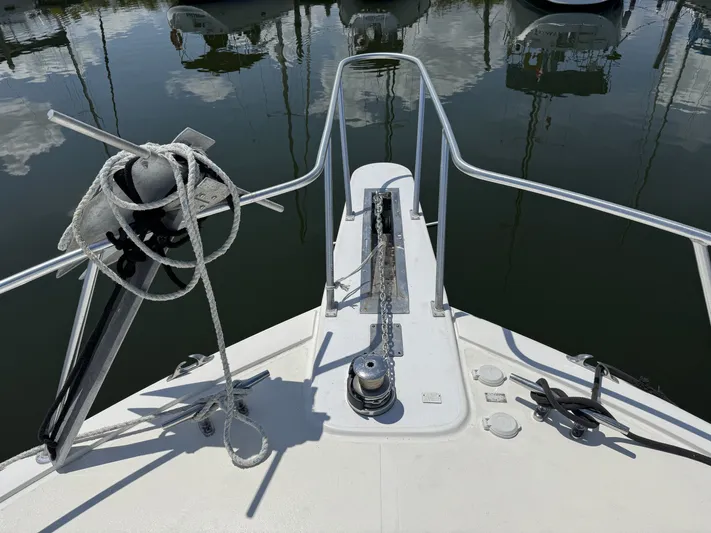 Calypso Yacht Photos Pics Bow of 1996 Viking 47 Convertible yacht with anchor and ropes.
