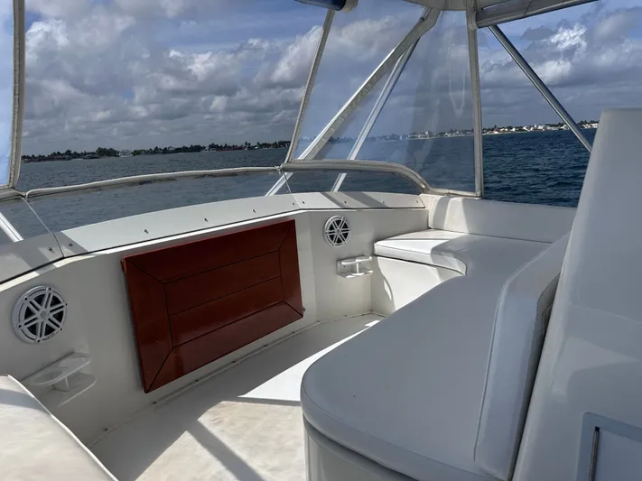 Calypso Yacht Photos Pics 1996 Viking 47 Convertible yacht interior with ocean view and seating area.