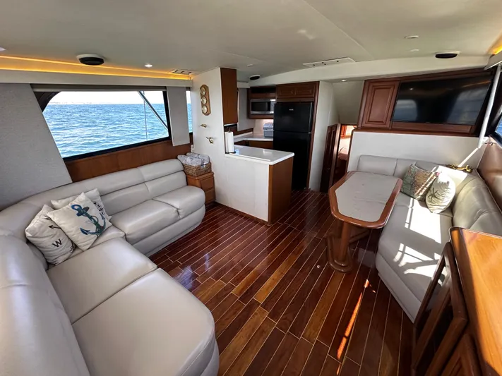 Calypso Yacht Photos Pics Luxurious interior of a 1996 Viking 47 Convertible yacht with ocean view.