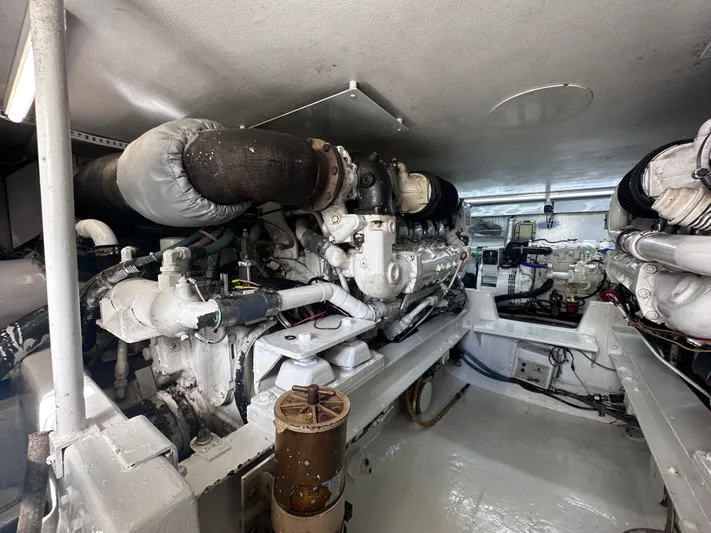 Calypso Yacht Photos Pics Engine room of a 1996 Viking 47 Convertible yacht, showcasing mechanical components.