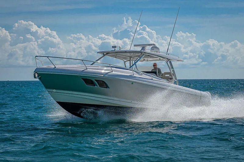  Yacht Photos Pics 2020 Intrepid 407 Cuddy cruising on open ocean under clear skies.