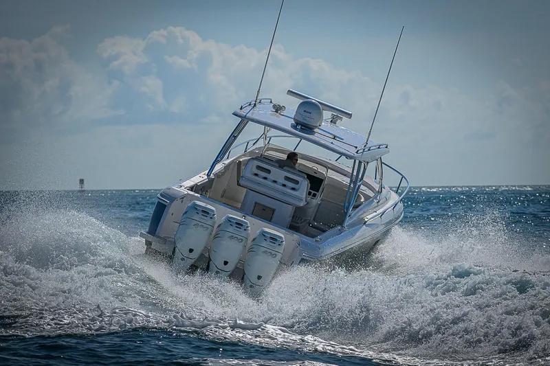  Yacht Photos Pics 2020 Intrepid 407 Cuddy speeding through ocean waves.