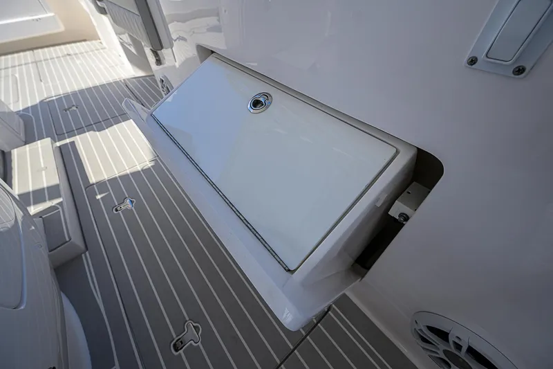  Yacht Photos Pics 2020 Intrepid 407 Cuddy boat deck with storage compartment and speakers.