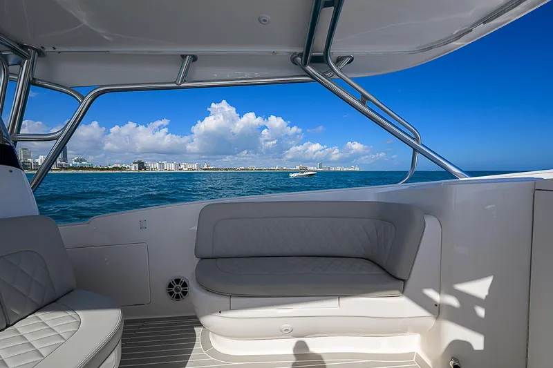  Yacht Photos Pics 2020 Intrepid 407 Cuddy boat interior with ocean view and blue sky.