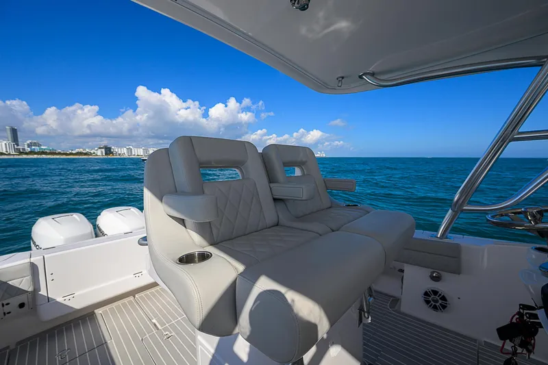 Yacht Photos Pics Intrepid 407 Cuddy 2020 boat interior with ocean view and luxury seating.