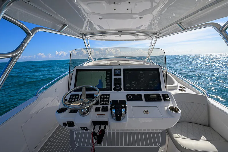  Yacht Photos Pics Intrepid 407 Cuddy 2020 helm with ocean view, featuring advanced navigation systems.
