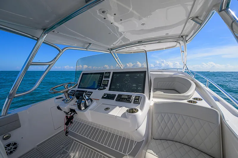  Yacht Photos Pics 2020 Intrepid 407 Cuddy boat helm with ocean view and modern controls.