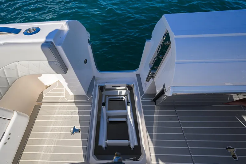  Yacht Photos Pics 2020 Intrepid 407 Cuddy boat deck with open hatch, ocean view.