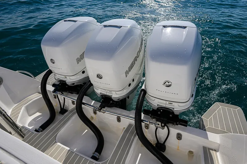  Yacht Photos Pics 2020 Intrepid 407 Cuddy with triple outboard engines on blue water.