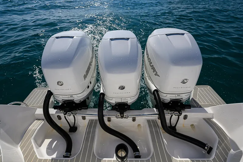  Yacht Photos Pics 2020 Intrepid 407 Cuddy with triple Mercury outboard engines on water.