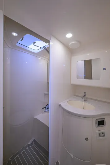  Yacht Photos Pics 2020 Intrepid 407 Cuddy bathroom with modern fixtures and skylight.
