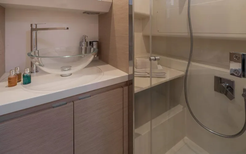 40f Open O/b Yacht Photos Pics Modern bathroom in 2024 Solaris Power SP 40F open yacht, featuring glass sink and shower.
