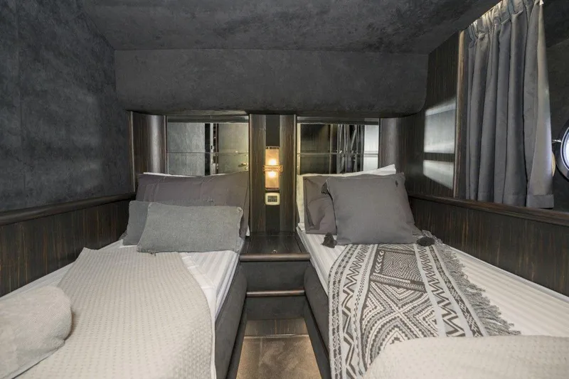  Yacht Photos Pics Luxurious twin cabin interior of 2005 Azimut 68 yacht with elegant bedding and decor.