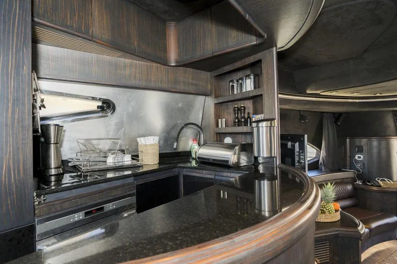  Yacht Photos Pics Luxurious kitchen interior of a 2005 Azimut 68 yacht with modern amenities and sleek design.
