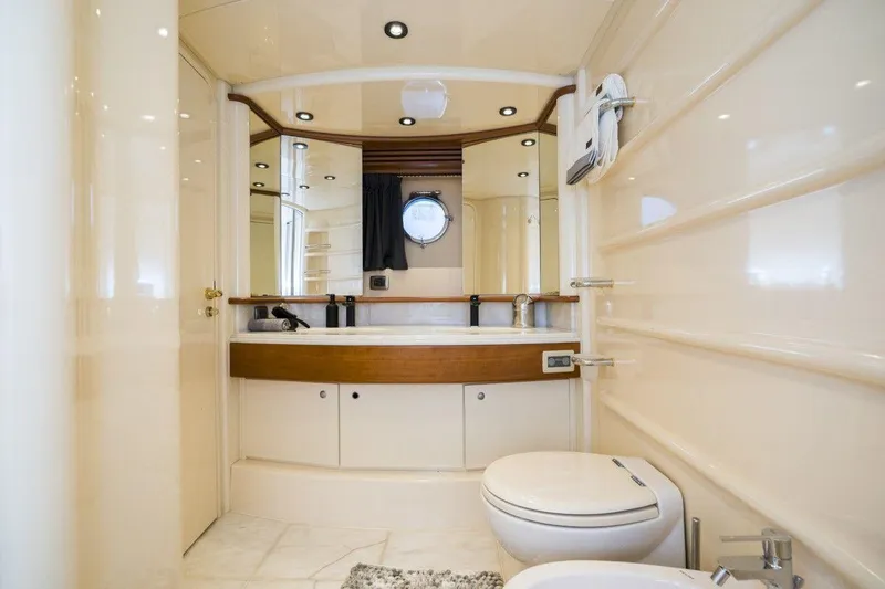 Yacht Photos Pics Luxurious bathroom interior of 2005 Azimut 68 yacht with modern fixtures and elegant design.