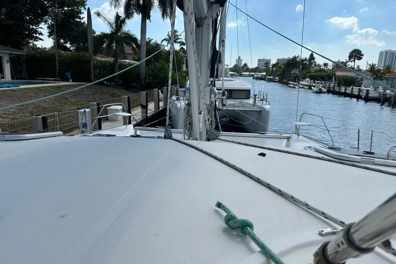  Yacht Photos Pics 2011 Robertson & Caine Leopard 46 catamaran docked by a scenic waterfront.