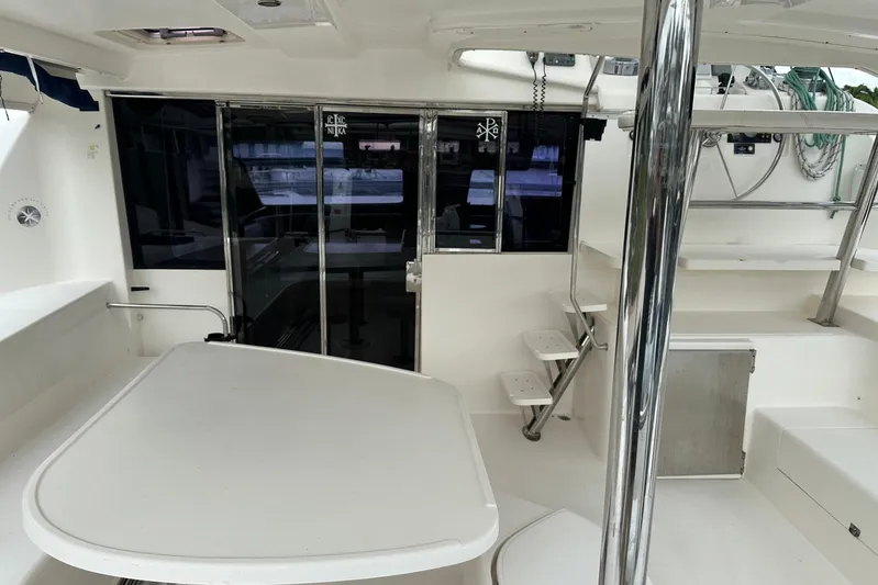  Yacht Photos Pics Interior view of 2011 Robertson & Caine Leopard 46 catamaran, featuring seating and helm area.