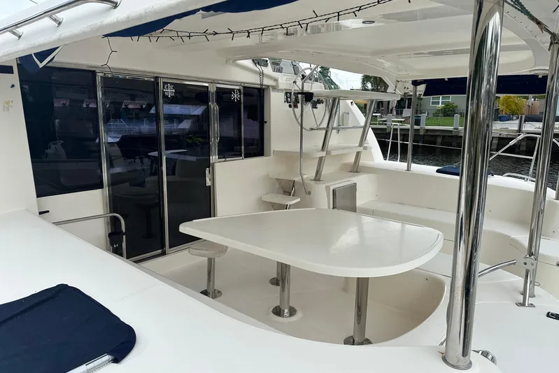  Yacht Photos Pics Spacious deck of 2011 Robertson & Caine Leopard 46 catamaran with seating and table.