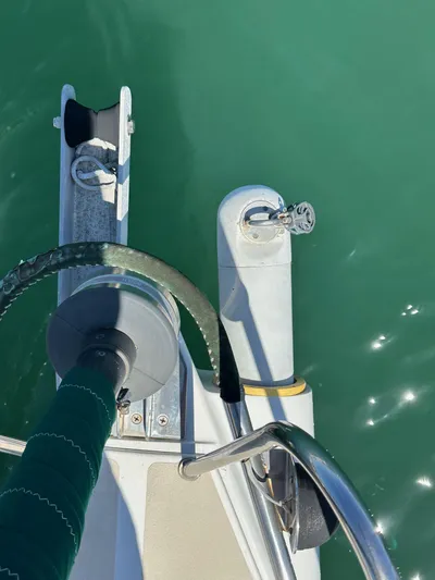 Ma Jolie Yacht Photos Pics Deck view of a 1996 J Boats J/120 sailboat on calm green water.