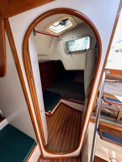 Ma Jolie Yacht Photos Pics 1996 J Boats J/120 cabin interior with wood trim and cozy seating area.