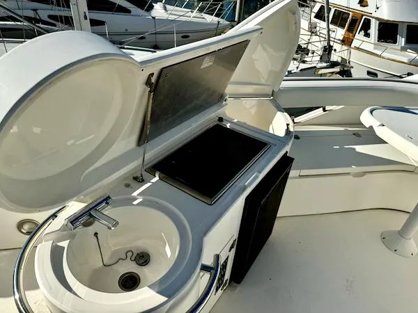 Coastal Pioneer Yacht Photos Pics 2002 Fairline Phantom 50 yacht deck with sink and grill.