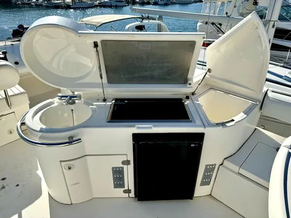 Coastal Pioneer Yacht Photos Pics Fairline Phantom 50 yacht outdoor kitchen, 2002 model, featuring sink and storage.