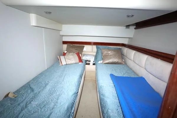 Coastal Pioneer Yacht Photos Pics Twin cabin with blue bedding in 2002 Fairline Phantom 50 yacht.
