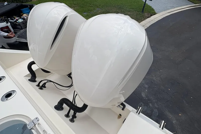 Joe Yacht Photos Pics 2018 Cobia 301 Center Console boat with dual outboard motors.