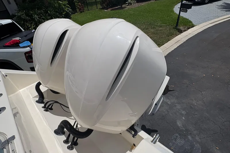 Joe Yacht Photos Pics 2018 Cobia 301 Center Console with dual outboard engines in driveway.