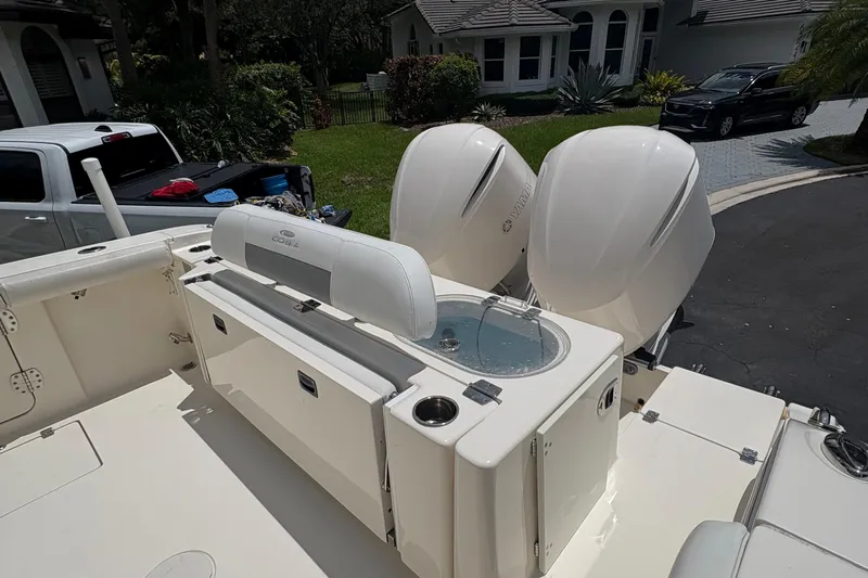 Joe Yacht Photos Pics 2018 Cobia 301 Center Console boat with dual Yamaha engines and seating area.