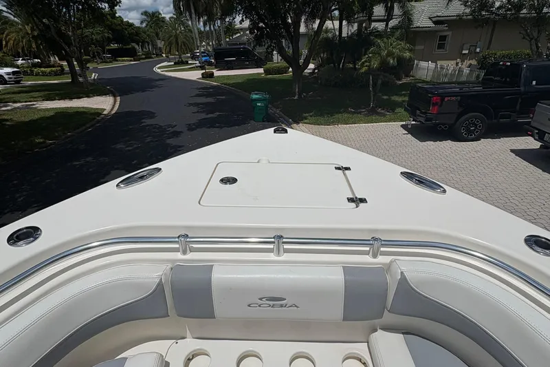 Joe Yacht Photos Pics 2018 Cobia 301 Center Console boat parked in a residential driveway.