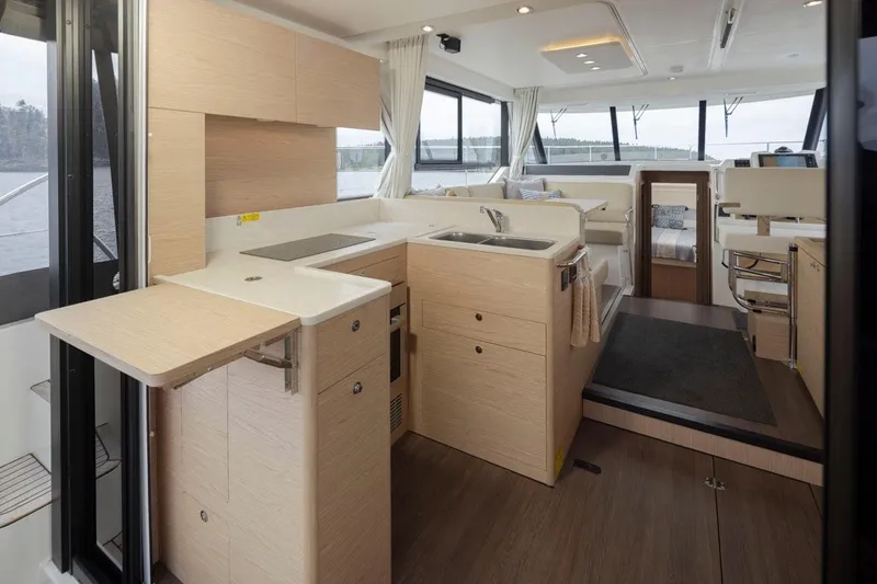 4 My Valentine Yacht Photos Pics Interior of 2022 Beneteau Swift Trawler 41, featuring modern kitchen and seating area.