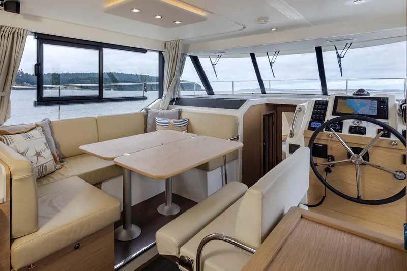 4 My Valentine Yacht Photos Pics Interior of 2022 Beneteau Swift Trawler 41 with helm and seating area.