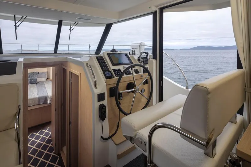 4 My Valentine Yacht Photos Pics Interior of 2022 Beneteau Swift Trawler 41 with helm, seating, and cabin view.