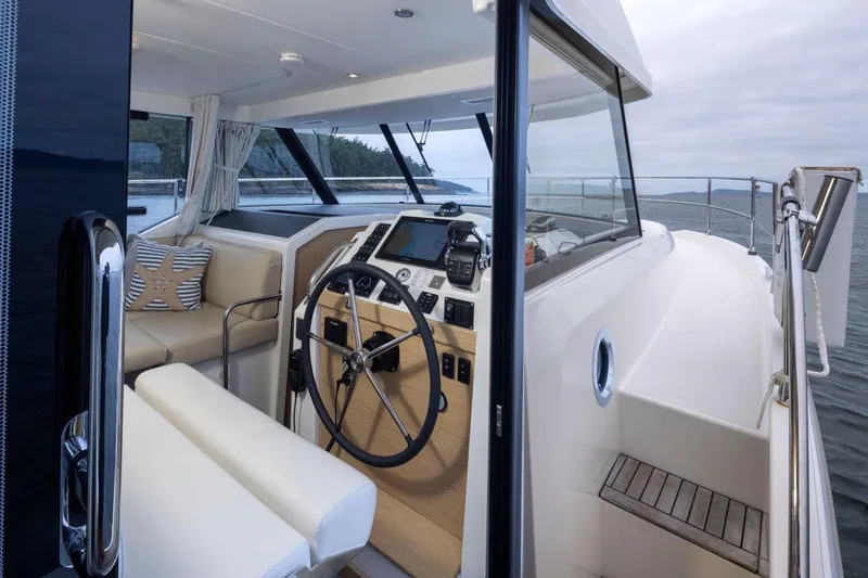 4 My Valentine Yacht Photos Pics 2022 Beneteau Swift Trawler 41 helm station with modern controls and ocean view.